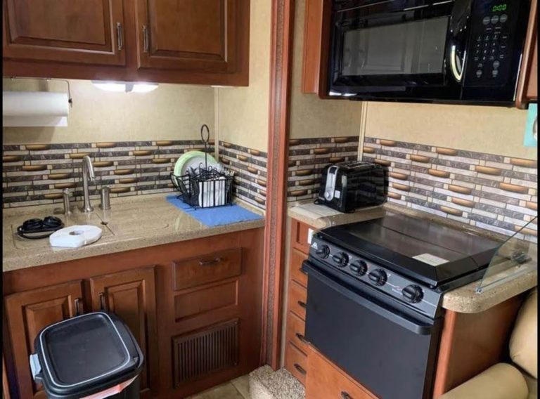 Kitchen with stove, oven and microwave