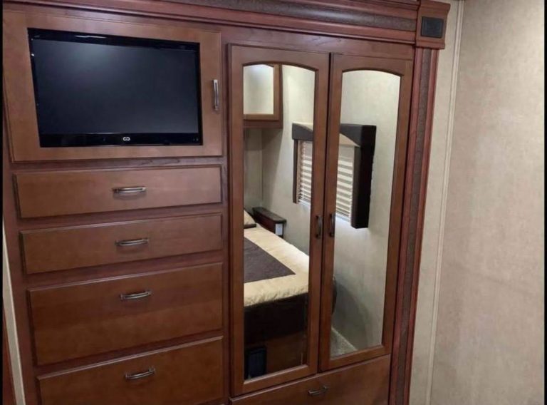 Master wardrobe with TV in the cabinet door